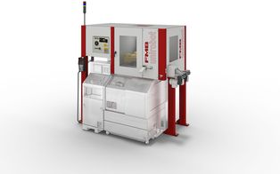 unirobot PORTAL 2TB - A compact automation cell in the form of an overhead installation above a lathe, with conveyor belt system for workpiece feed and removal.